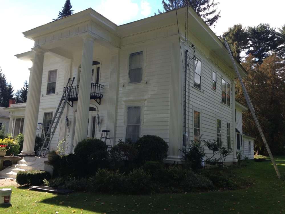 Commercial painting company at work on a large building in Thomaston, Connecticut